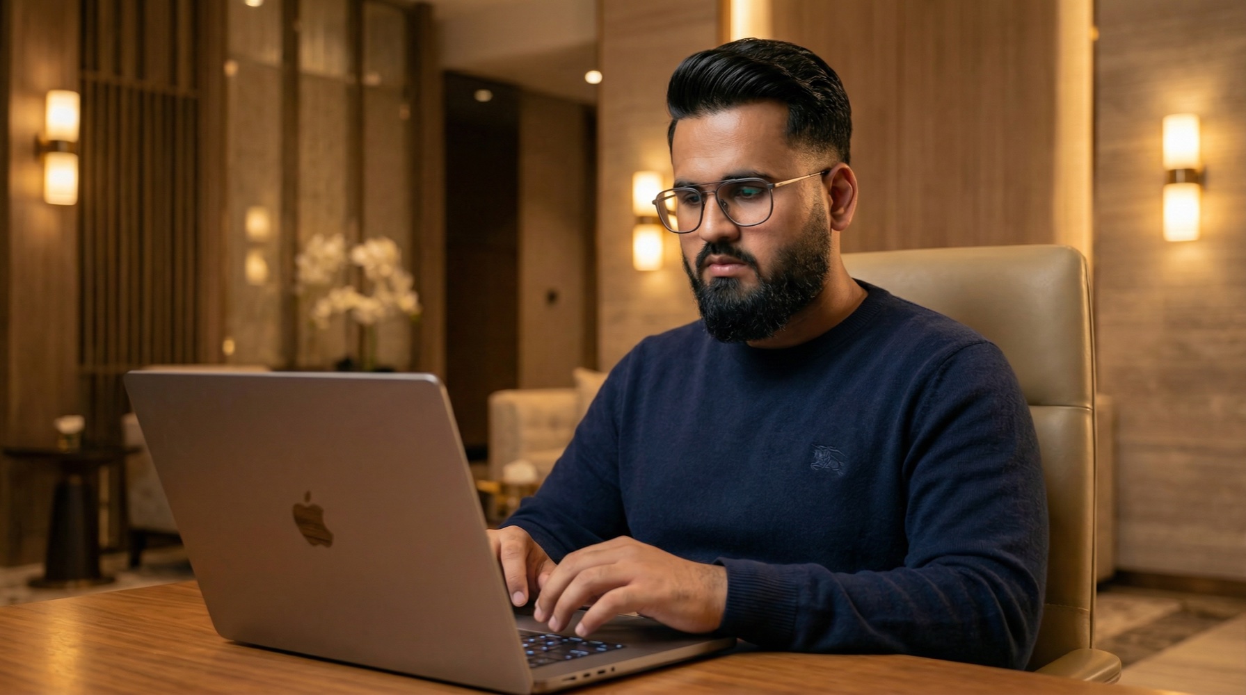 Ali Akbar, founder of Whitelabeler, working on a laptop
